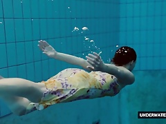 Hot big titted teen Lera swimming in the pool