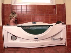 Sandra Boobies is soaking in the tub when her boyfriend...